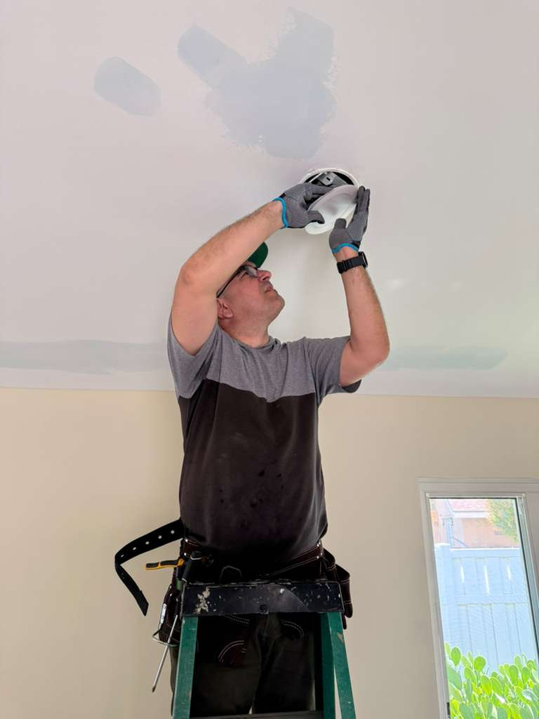 Recessed downlight installation with ceiling drywall patching