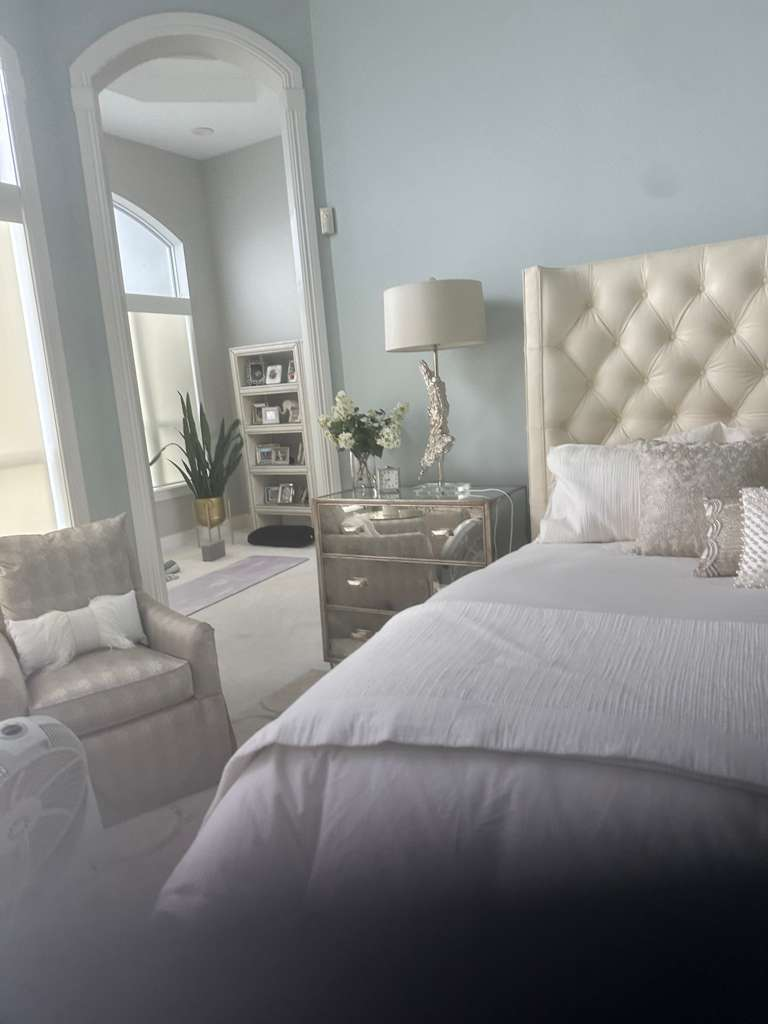 Master suite with arched openings and built-ins