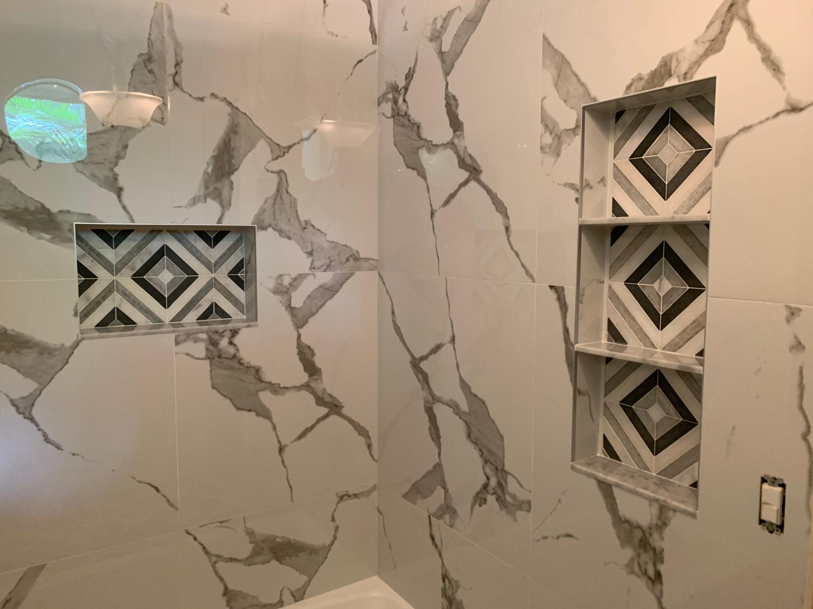 Marble shower with custom recessed niche details