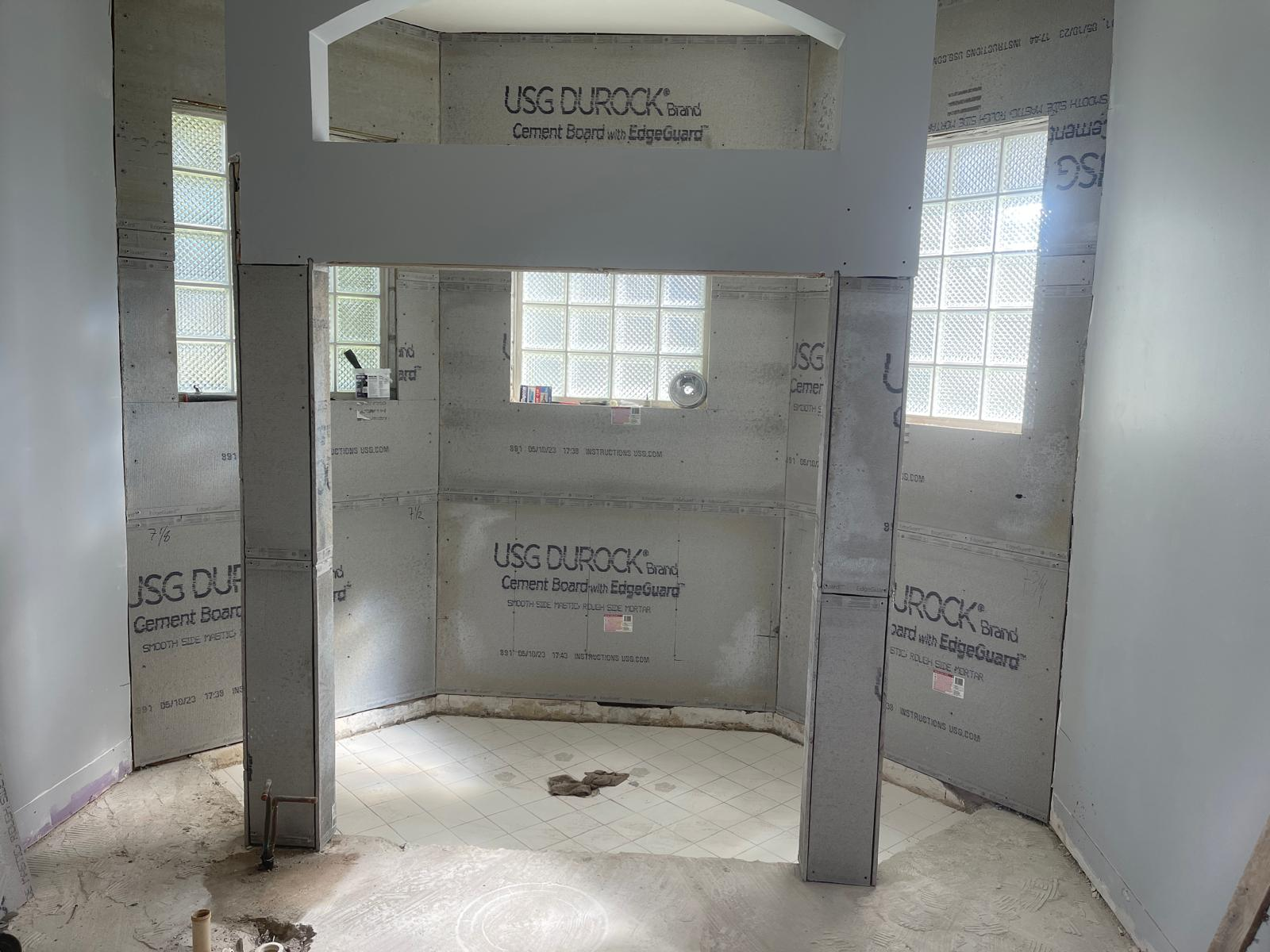 Bathroom remodel in progress with cement board framing