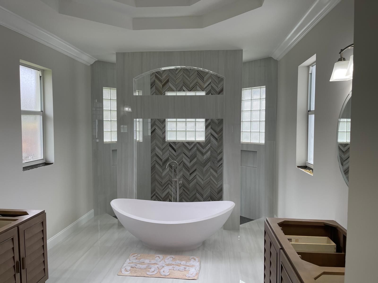 Finished master bathroom with freestanding tub centerpiece